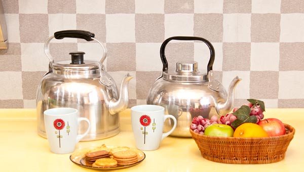 Two KRSNA aluminium kettles with tea service