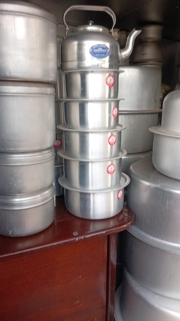 Aluminium utensil stock stacked at the factory store
